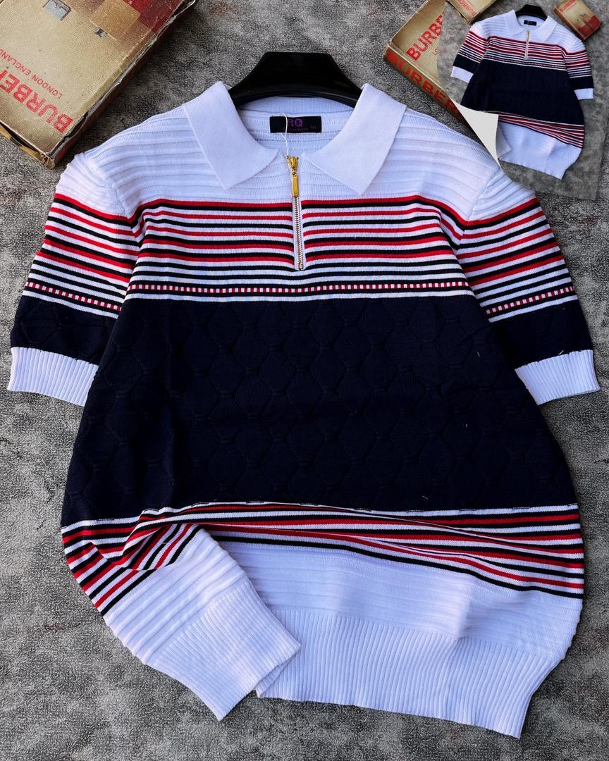 Red white and navy colorblock knit polo with diamond texture, shown on hanger.