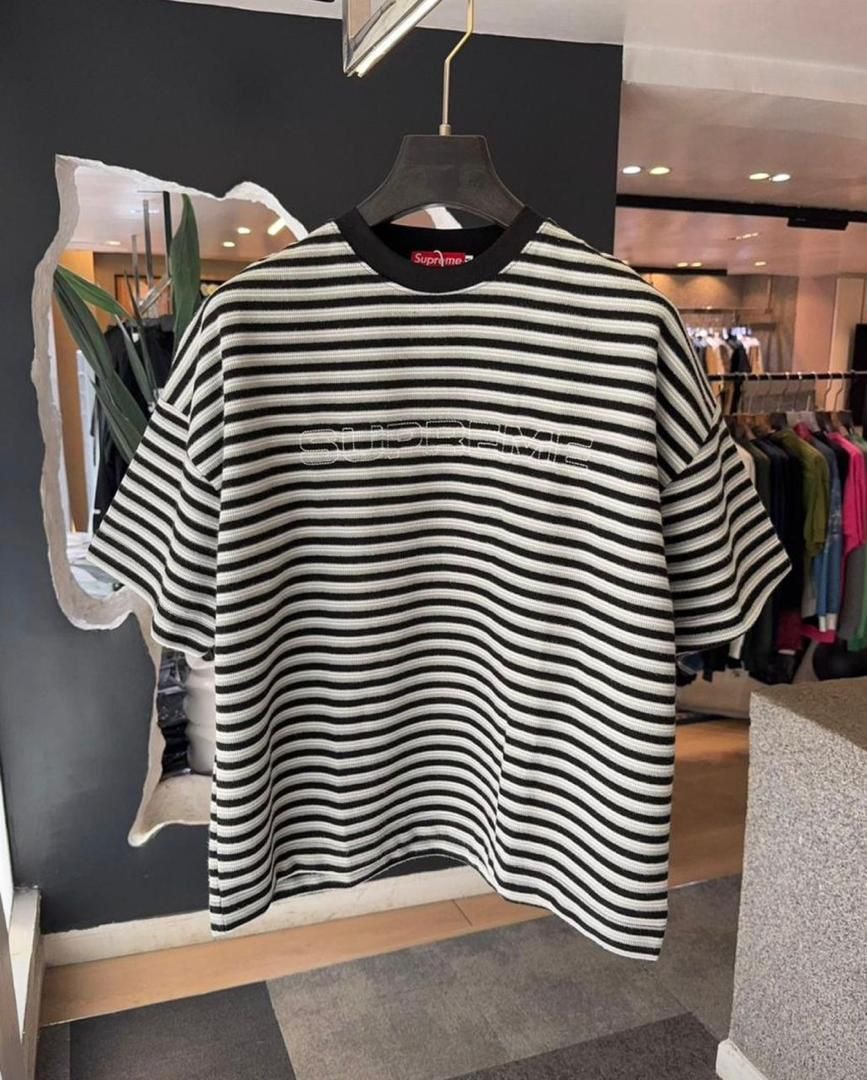 Black and white striped Supreme t-shirt on hanger displaying full oversized fit.