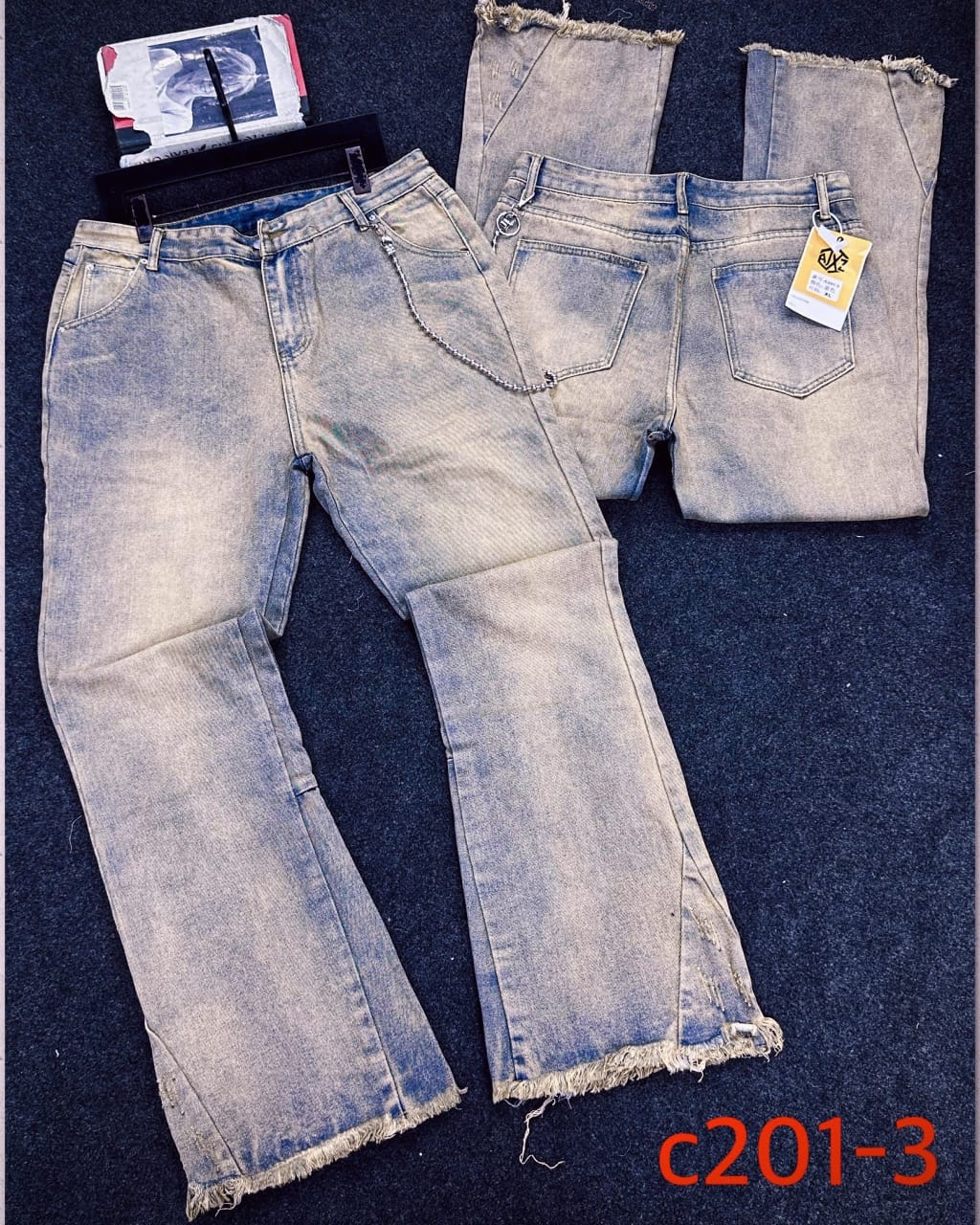 Faded light blue baggy jeans with chain detail shown in front and back views.