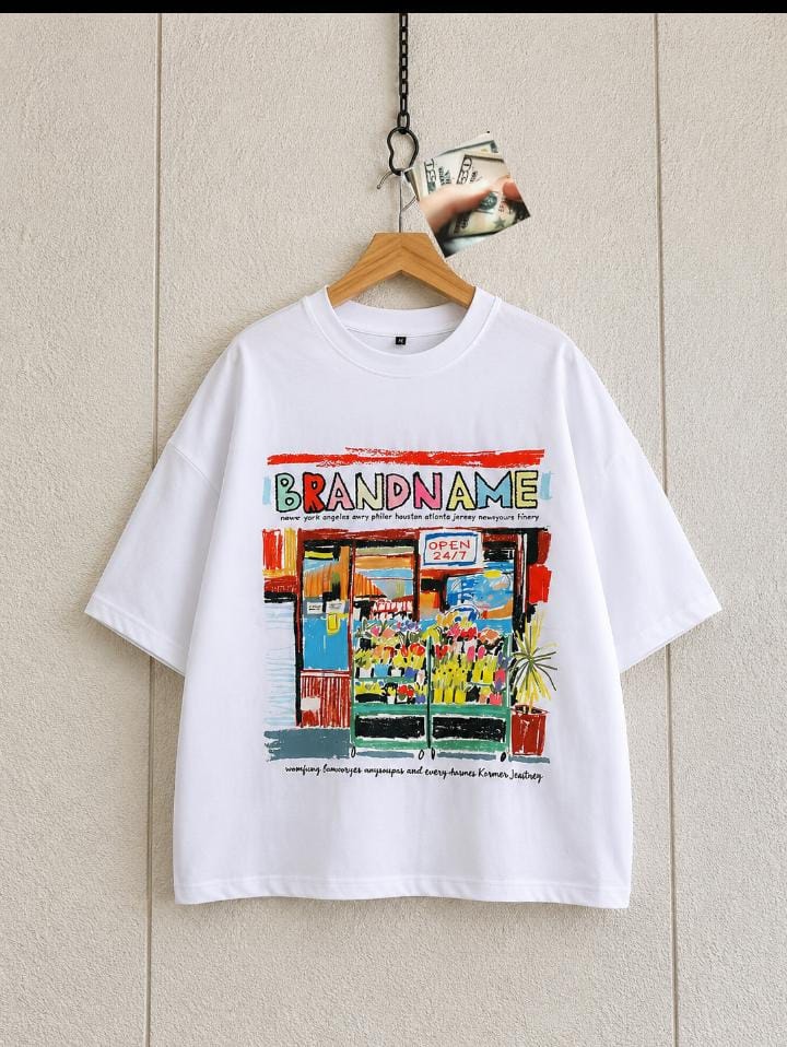 White oversized t-shirt with colorful storefront Brandname graphic.