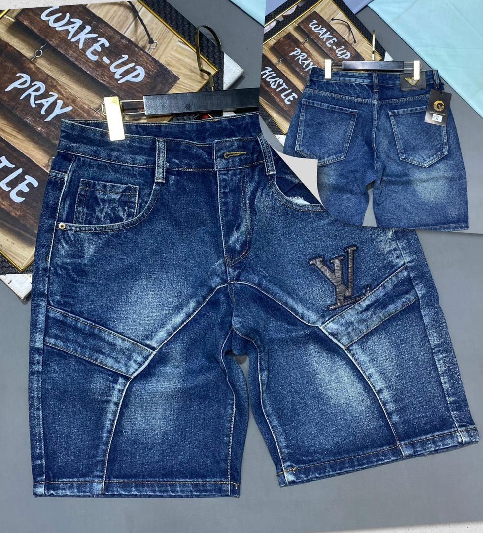 Blue denim jorts with LV logo patch on back pocket, shown in front and back views on hanger.