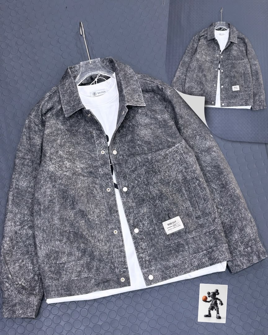Gray mottled acid-wash textured jacket with visible pocket patch.