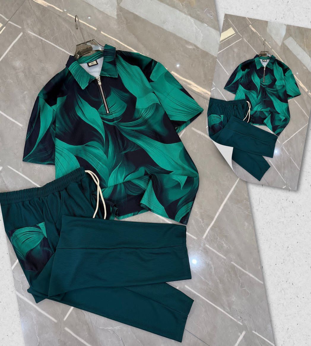 Green and black abstract print ribbed unisex two-piece set with shirt and trousers.