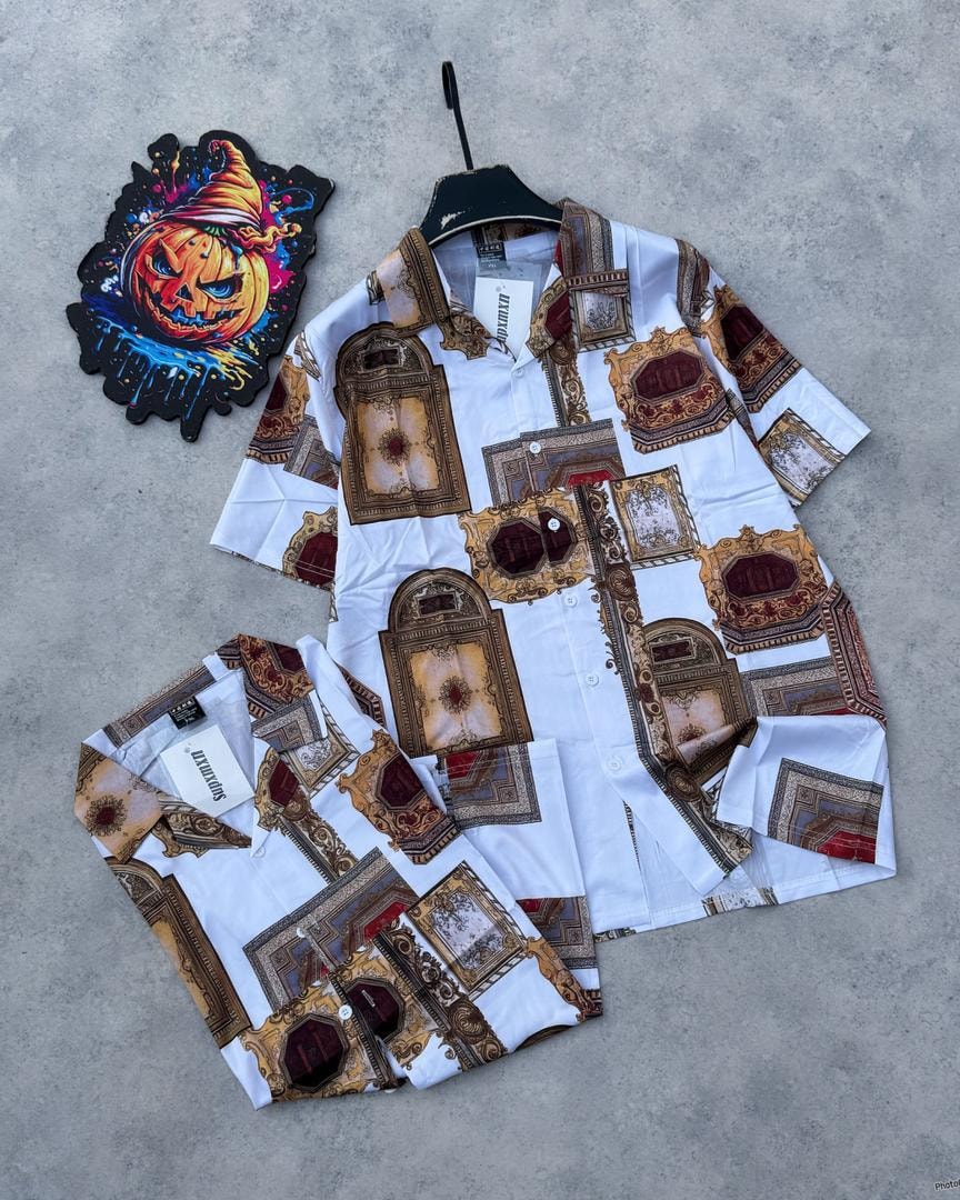 White short sleeve shirt with ornate gold and maroon frame pattern print.