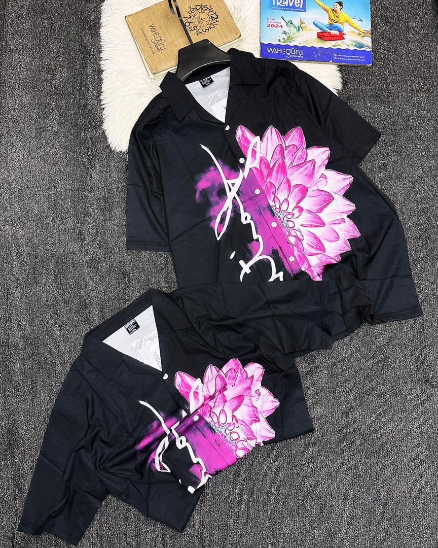 Black short sleeve shirt with large pink purple flower graphic and white script.