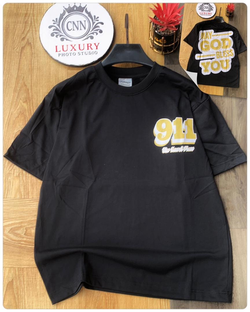 Black oversized t-shirt with yellow 911 graphic on the chest.