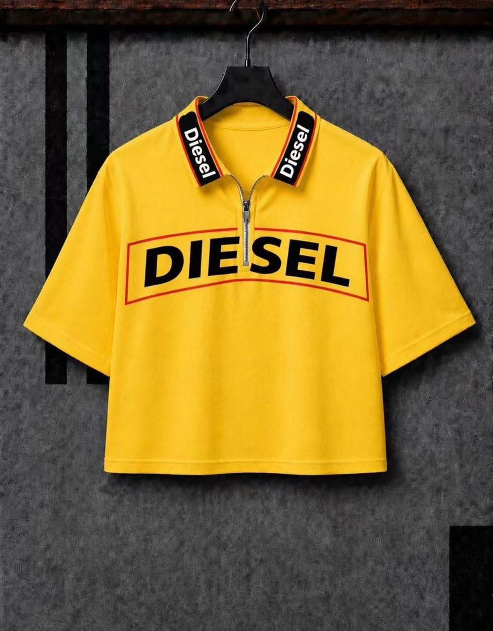 Yellow Diesel cropped zip polo tee on hanger displaying full front design.