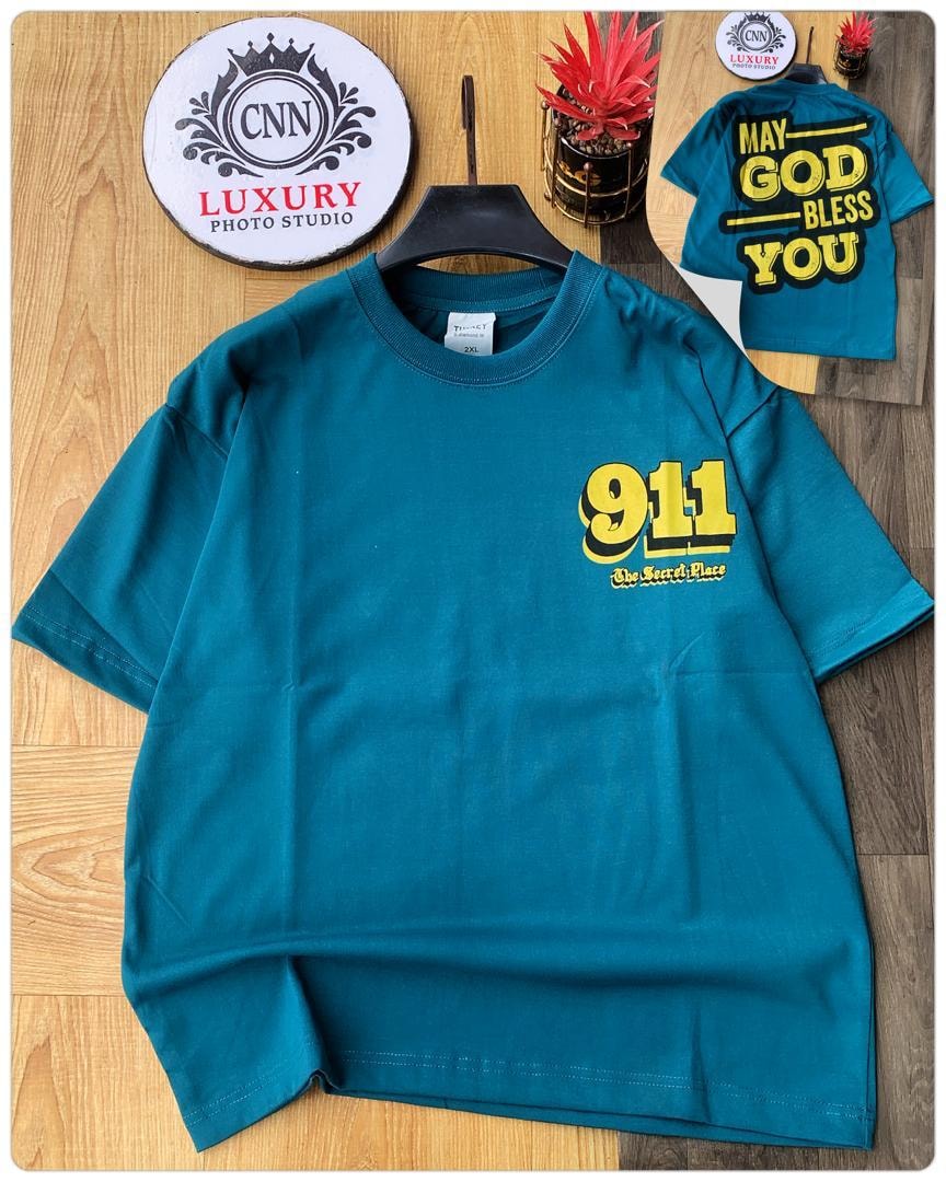 Teal t-shirt with yellow 911 graphic on chest.
