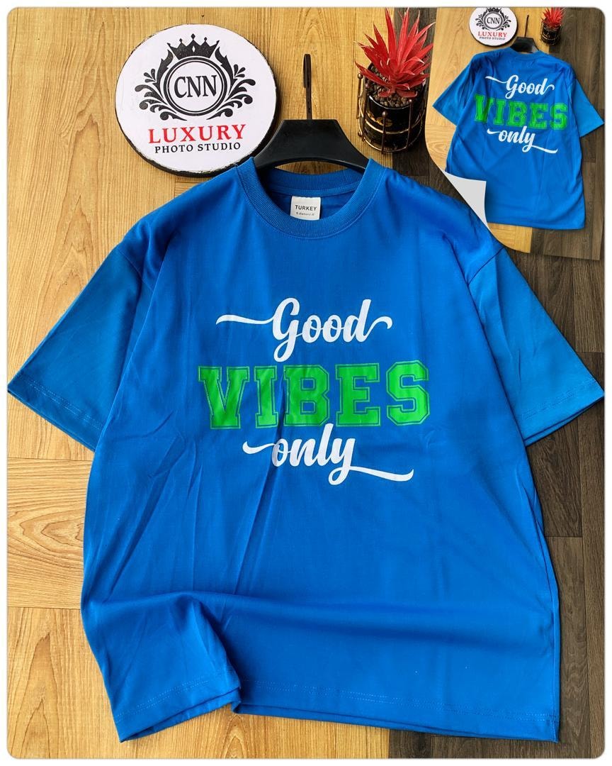 Blue t-shirt with Good VIBES only text in white and green.