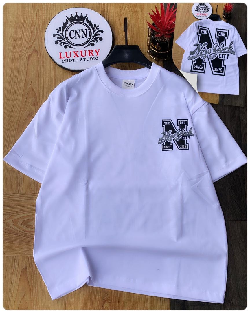 White t-shirt with New York City logo print on chest.