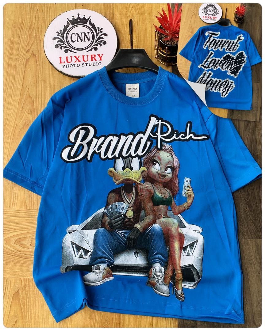 Blue t-shirt with Brand Rich text and cartoon characters on car graphic.