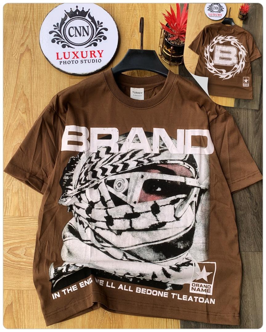 Brown t-shirt with keffiyeh graphic, BRAND text and bottom slogan.