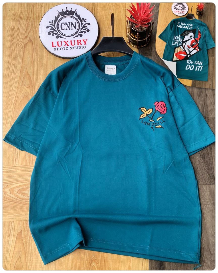 Teal round neck t-shirt with rose and LNM Doill embroidery on chest, back view with motivational text.