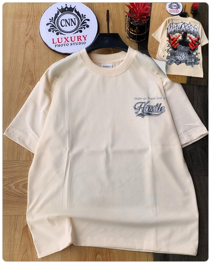 Cream round neck t-shirt with wake up thank god and hustle text on chest, inset of back design.