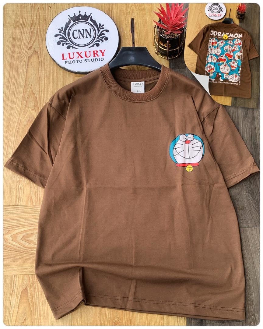 Brown round neck t-shirt with Doraemon face graphic on chest, inset showing back with Doraemon pattern.