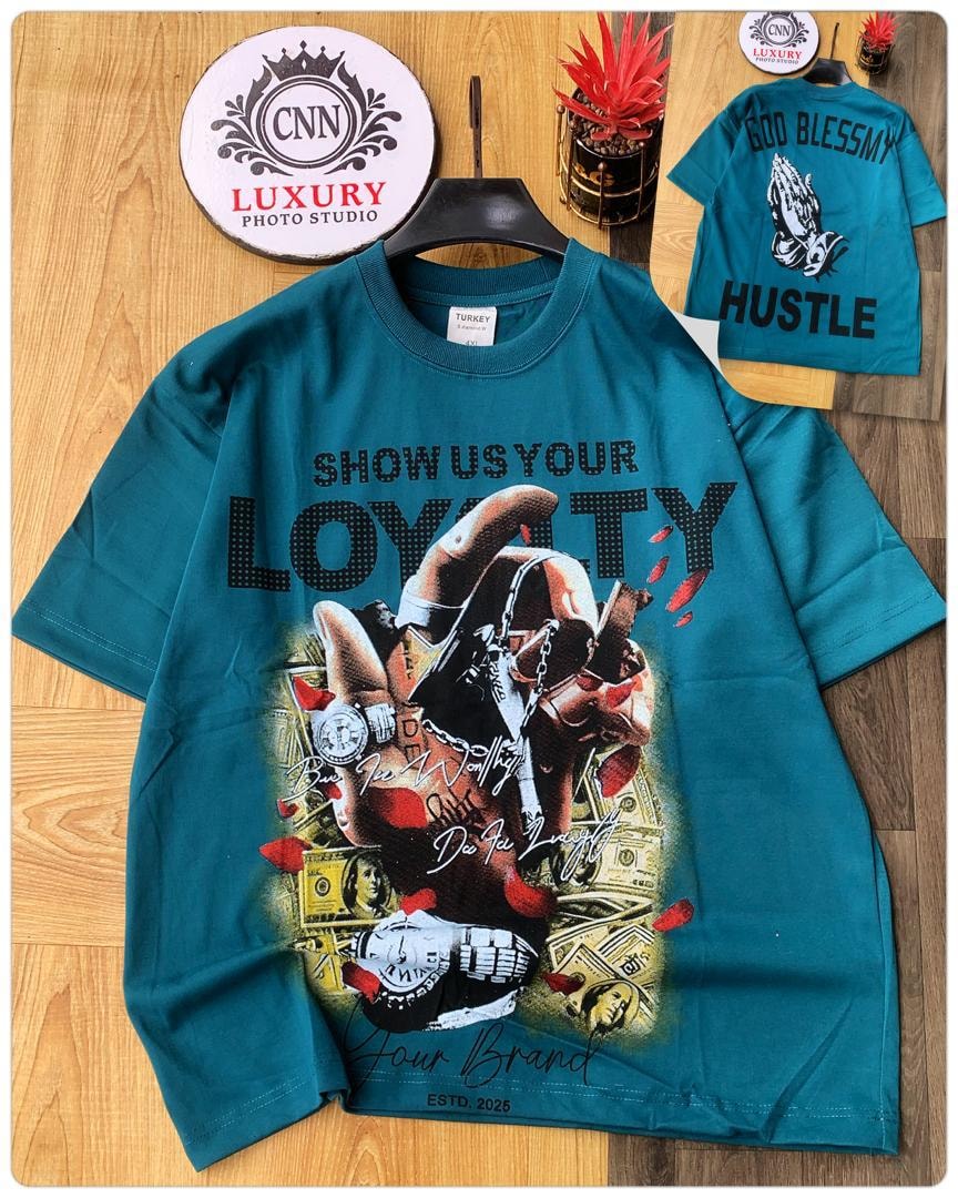 Teal round neck t-shirt displaying loyalty hand graphic with money and watches on front, back view inset with God Bless My Hustle print.
