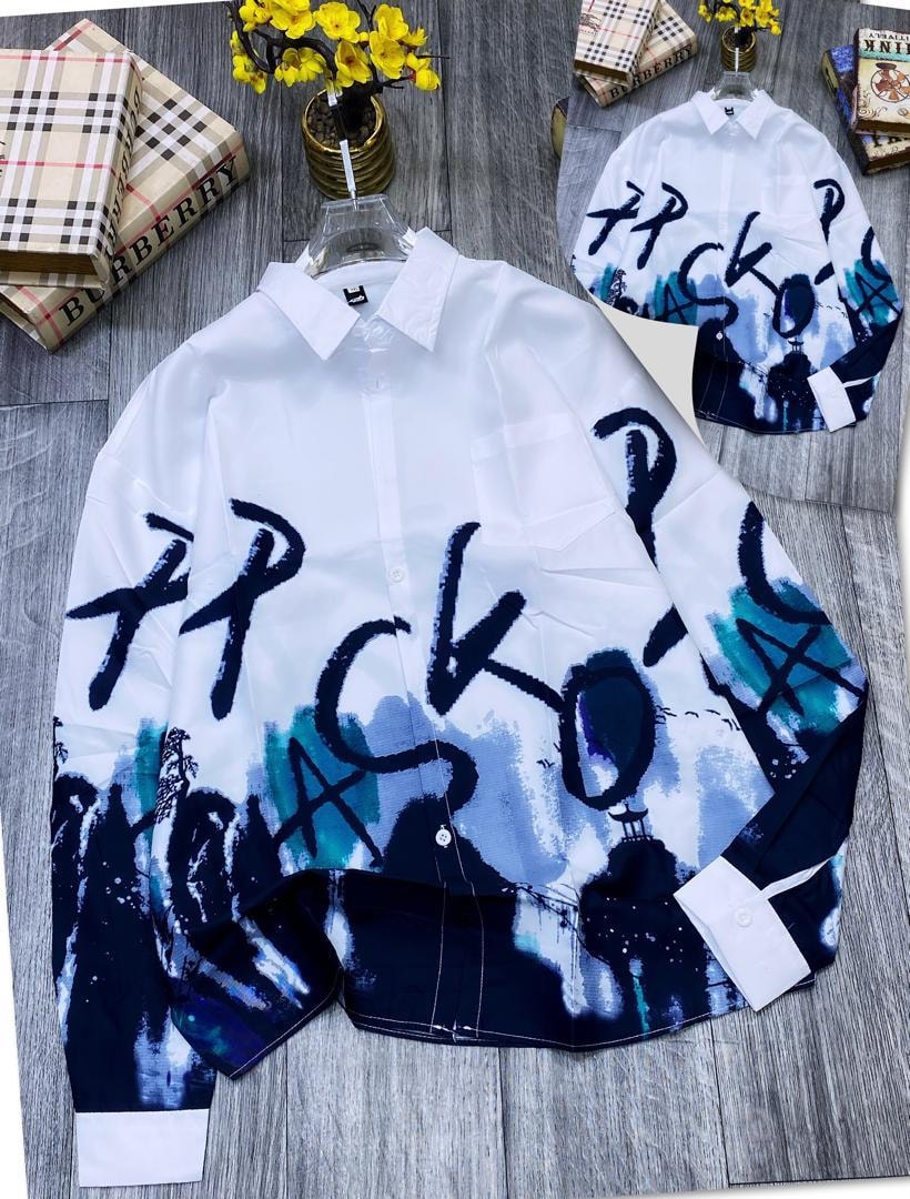 White shirt with black and blue graffiti print and ink wash effect laid flat with inset.