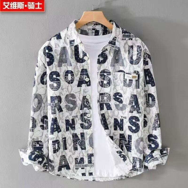 White button-down shirt with all-over navy text and pattern print.