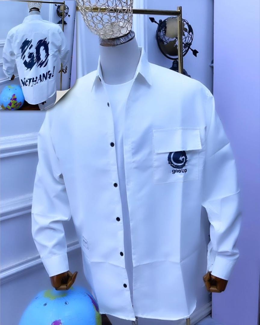 White GO NOTHING graphic button-down shirt on mannequin showing front pocket and back view inset.