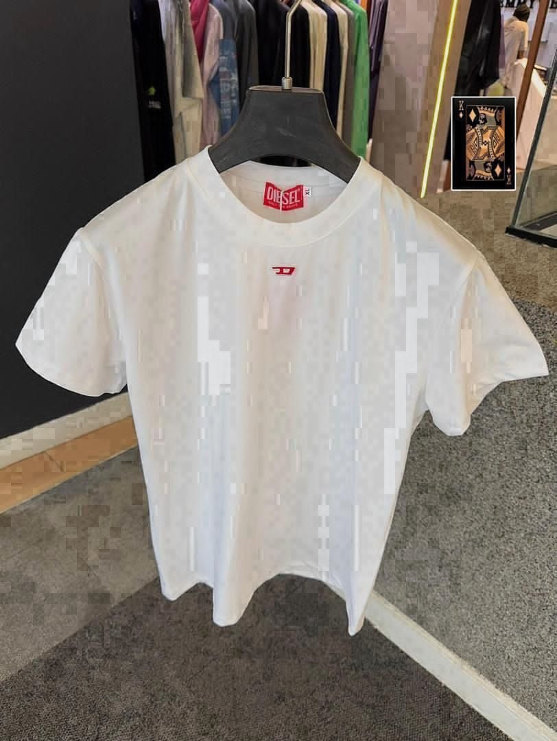 White Diesel t-shirt with all-over pixel pattern on hanger showing XL tag.