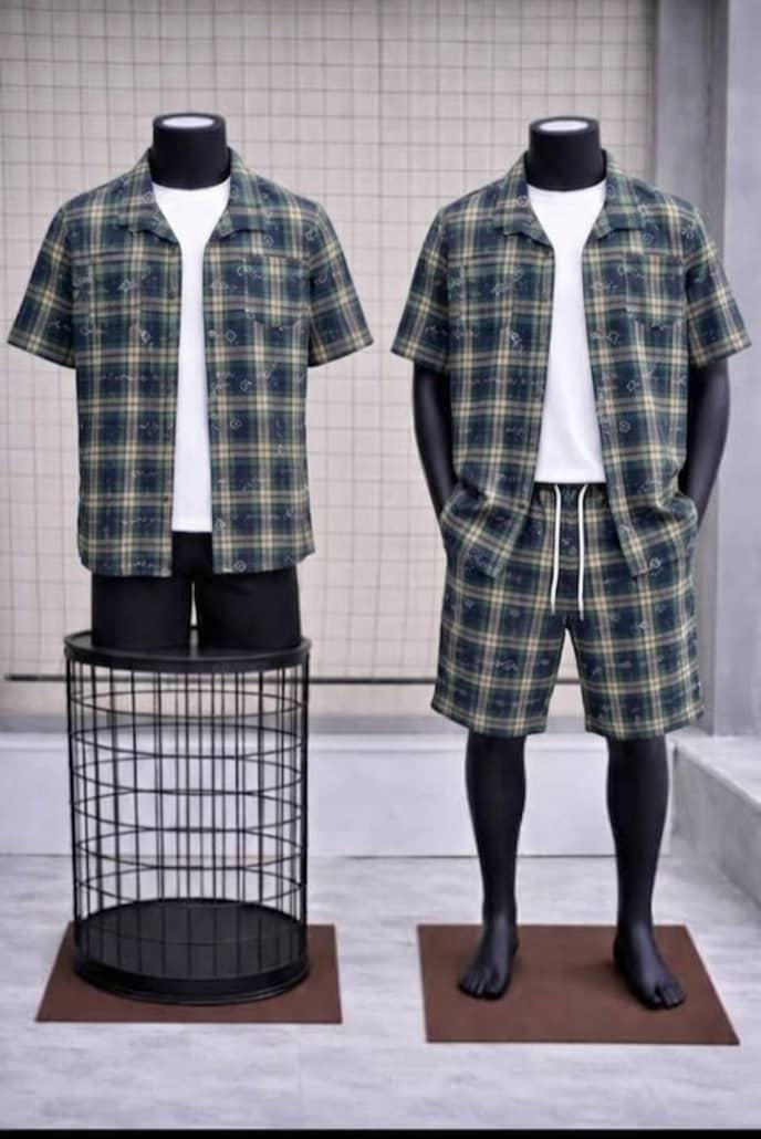Green plaid short sleeve shirt and matching shorts two-piece set on mannequins.