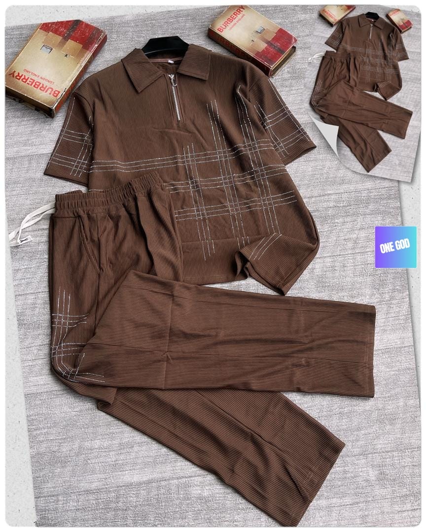 Brown ribbed polo and trousers two-piece set with white plaid stitching and Burberry props.
