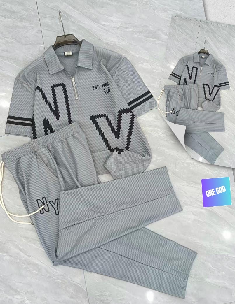 Gray ribbed polo and trousers two-piece set with large NY zigzag graphic and EST 1986 text.