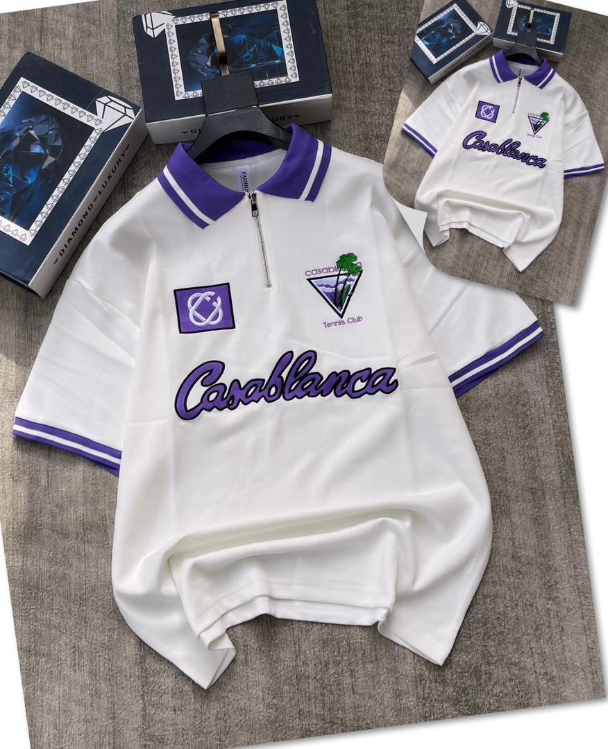 White zip polo shirt with purple Casablanca embroidery and logos.