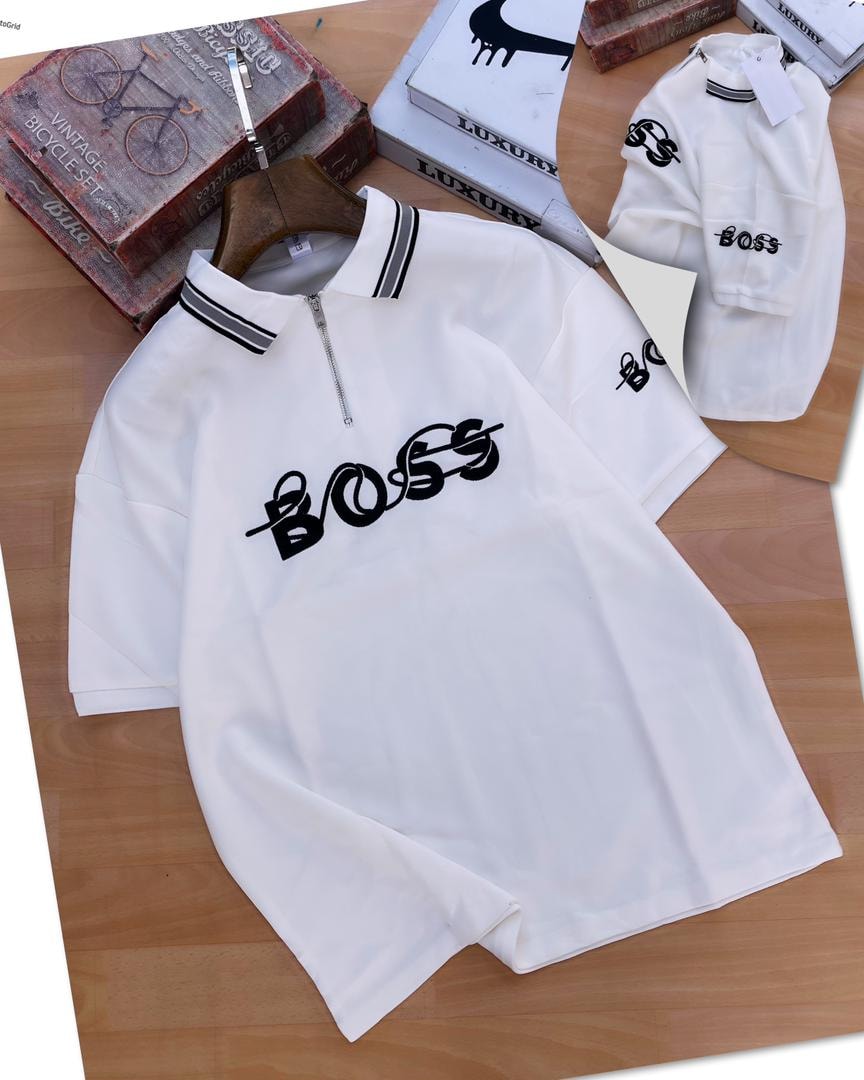 White zip polo shirt with black BOSS embroidery and props.