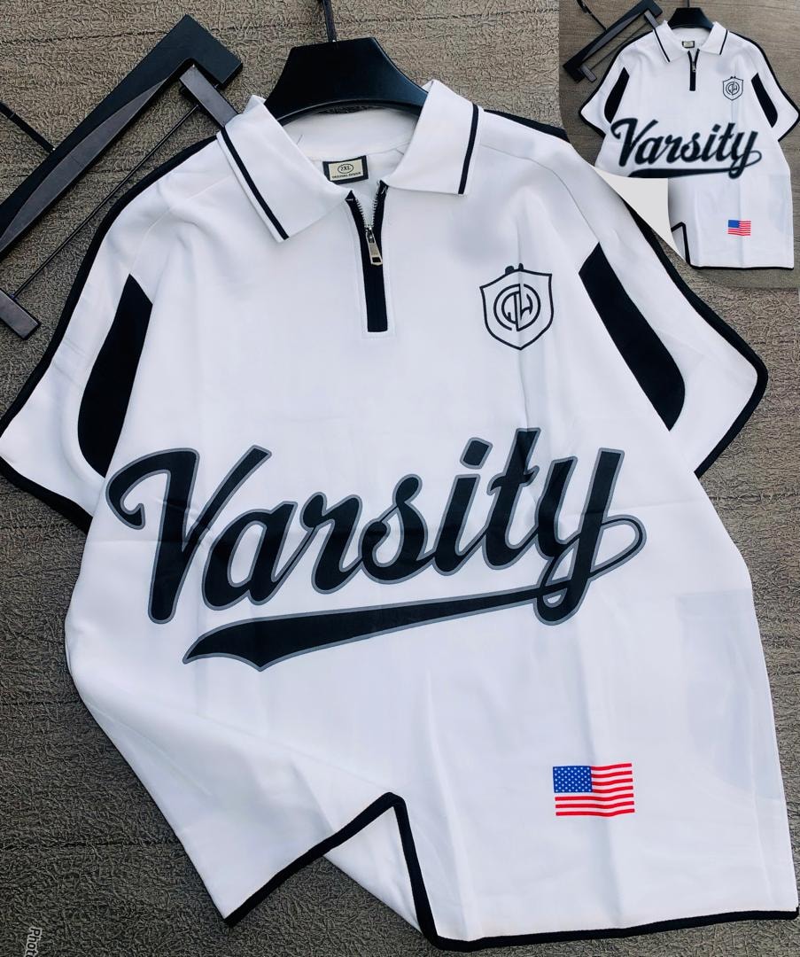 White Varsity quarter-zip polo shirt with black trim and graphic prints.