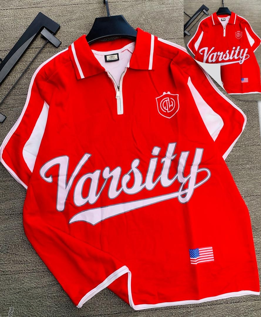 Red Varsity quarter-zip polo shirt with white trim and graphic prints.