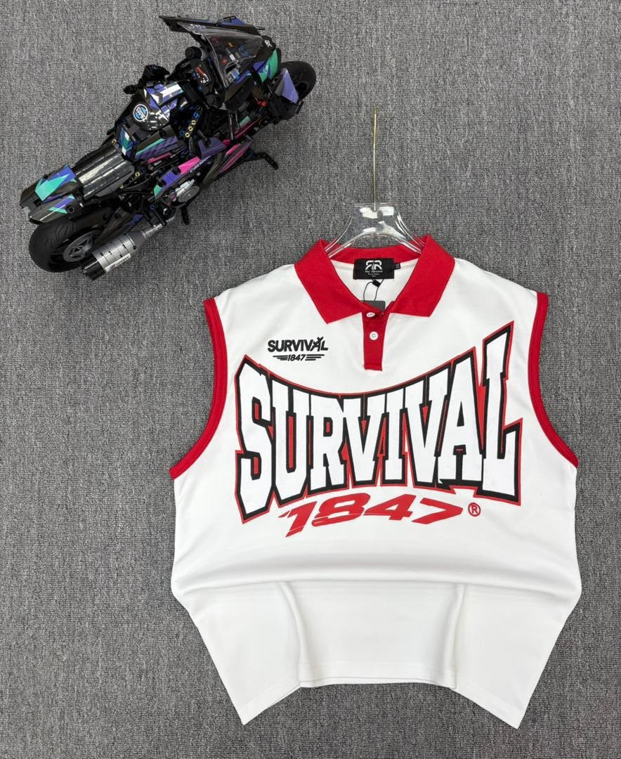 White sleeveless polo shirt with red trim and SURVIVAL 1847 graphic on hanger next to toy motorcycle.