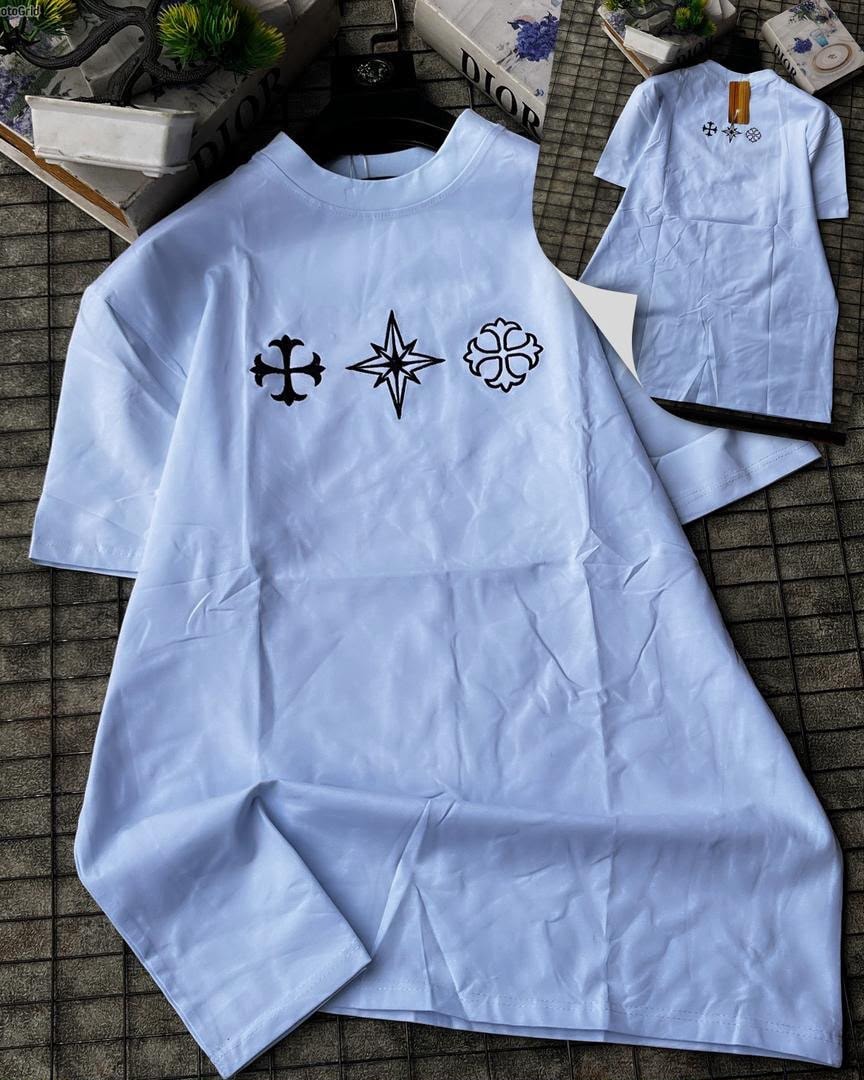 Light blue long sleeve t-shirt with three black symbols embroidered on chest.