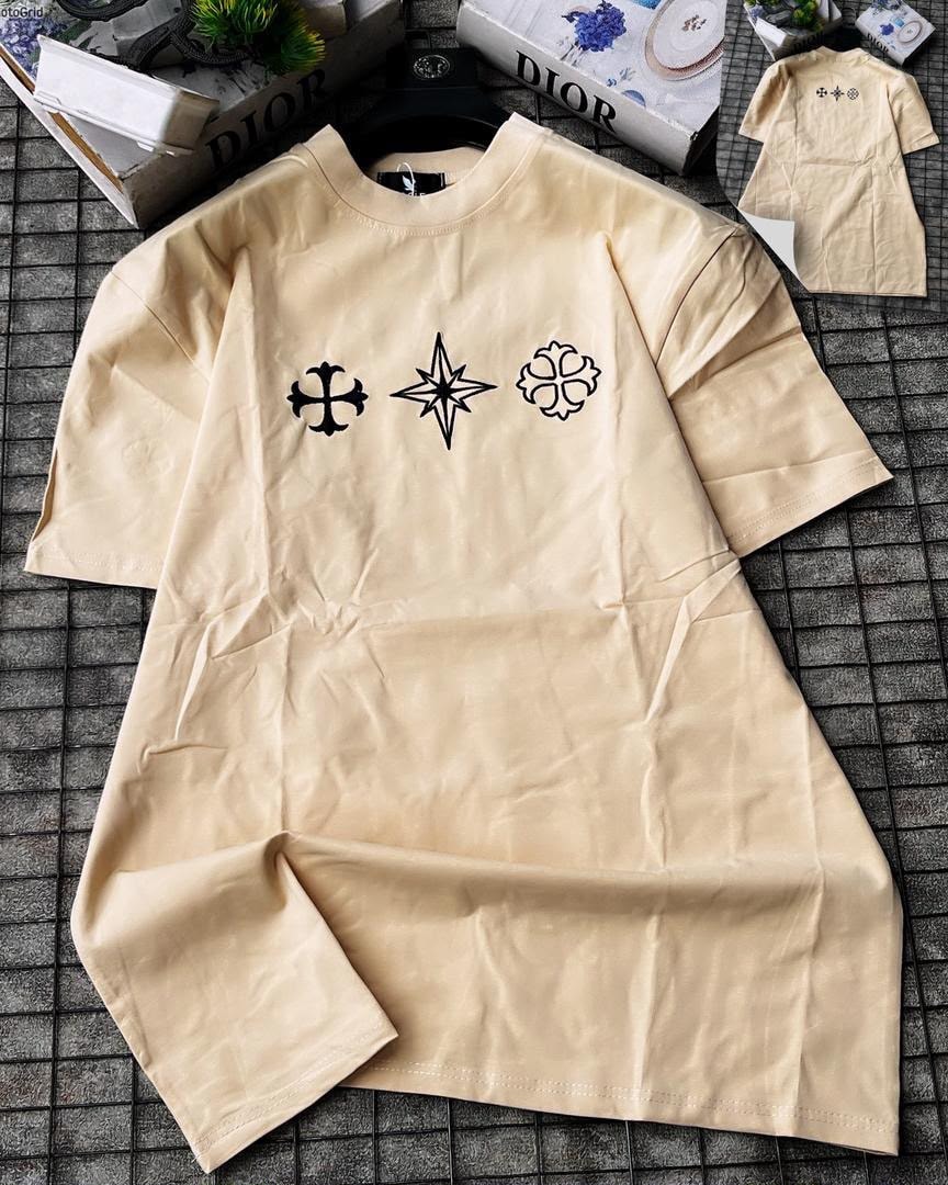 Beige long sleeve t-shirt with three black symbols embroidered on chest.