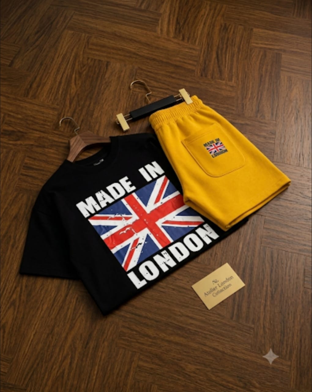 Black t-shirt with Made in London Union Jack graphic paired with yellow shorts.