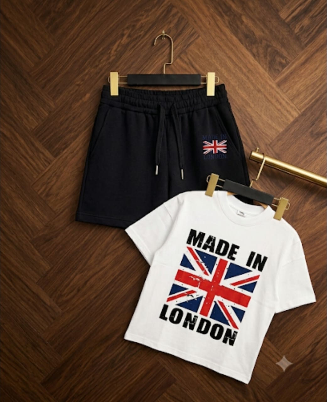 White t-shirt with Made in London Union Jack graphic paired with navy shorts.