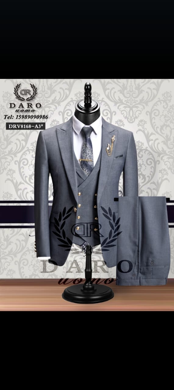Gray three-piece suit on mannequin with trousers displayed to the side.