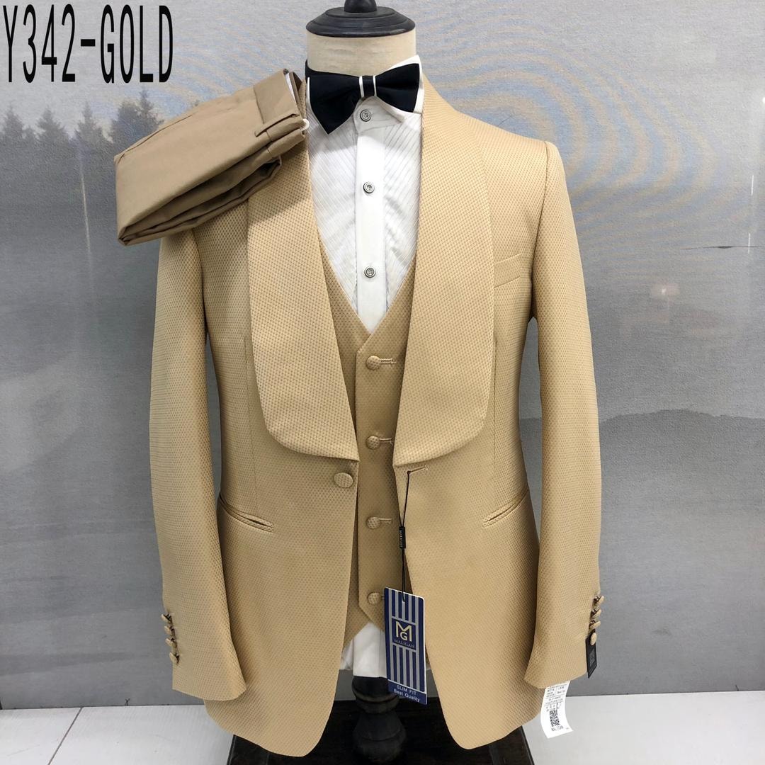 Gold textured three-piece suit with shawl lapels and bow tie on mannequin.