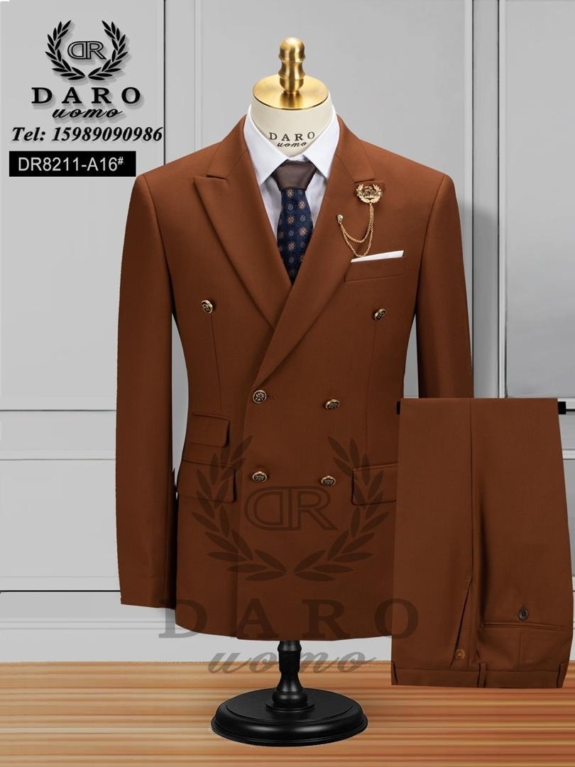 Brown double breasted suit on mannequin with trousers shown beside it.