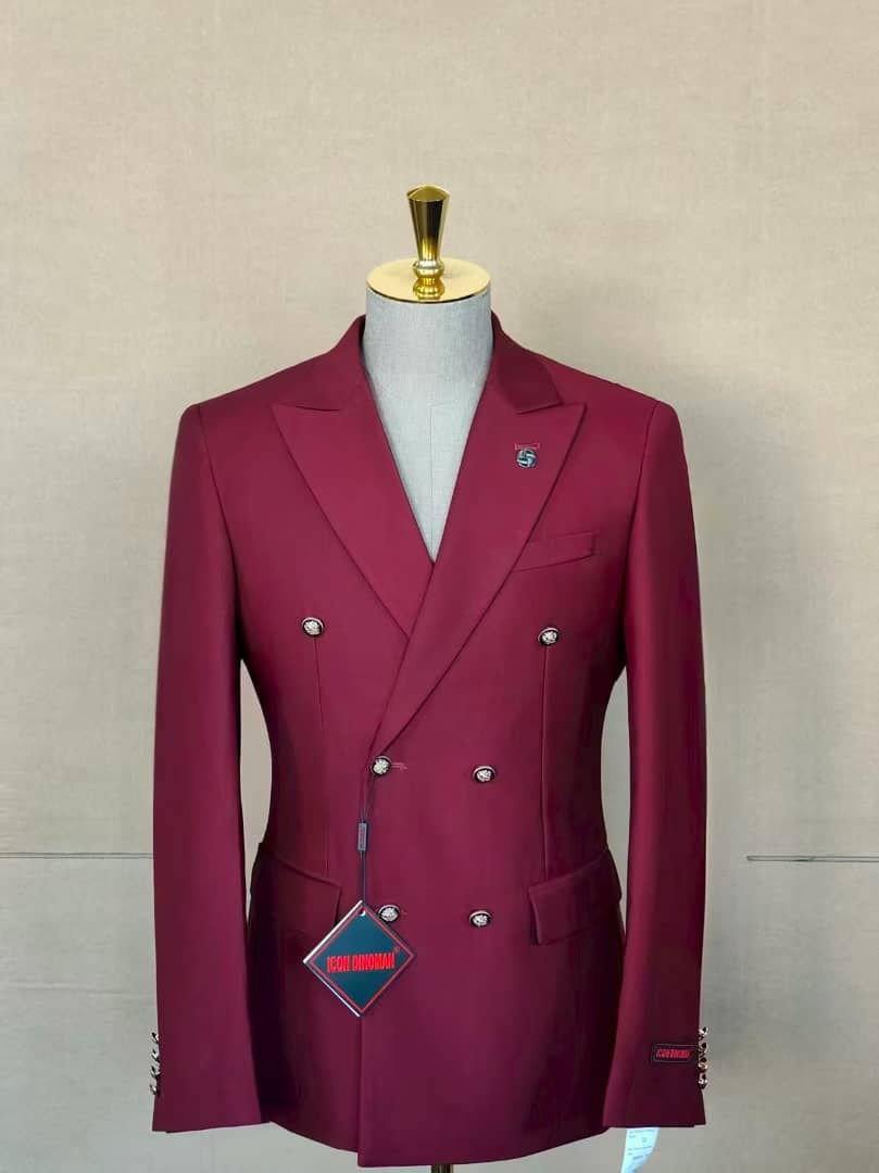 Burgundy double breasted suit jacket on mannequin with visible branding tag.