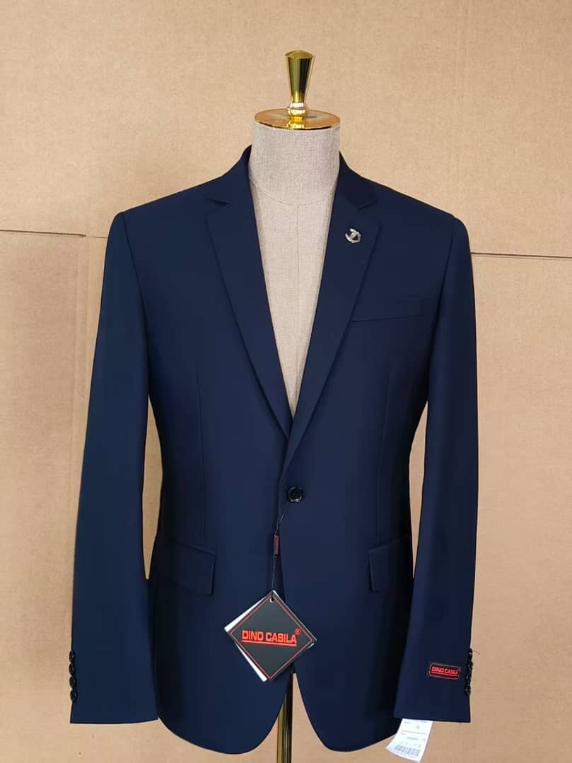 Navy single breasted Dino Casila blazer on mannequin with brand tags visible.