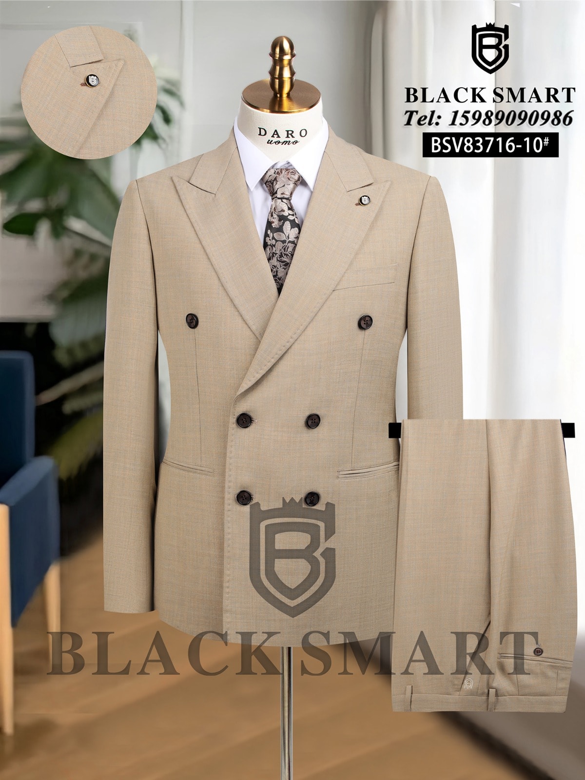Beige double breasted Black Smart suit with patterned tie, white shirt and trousers on mannequin.