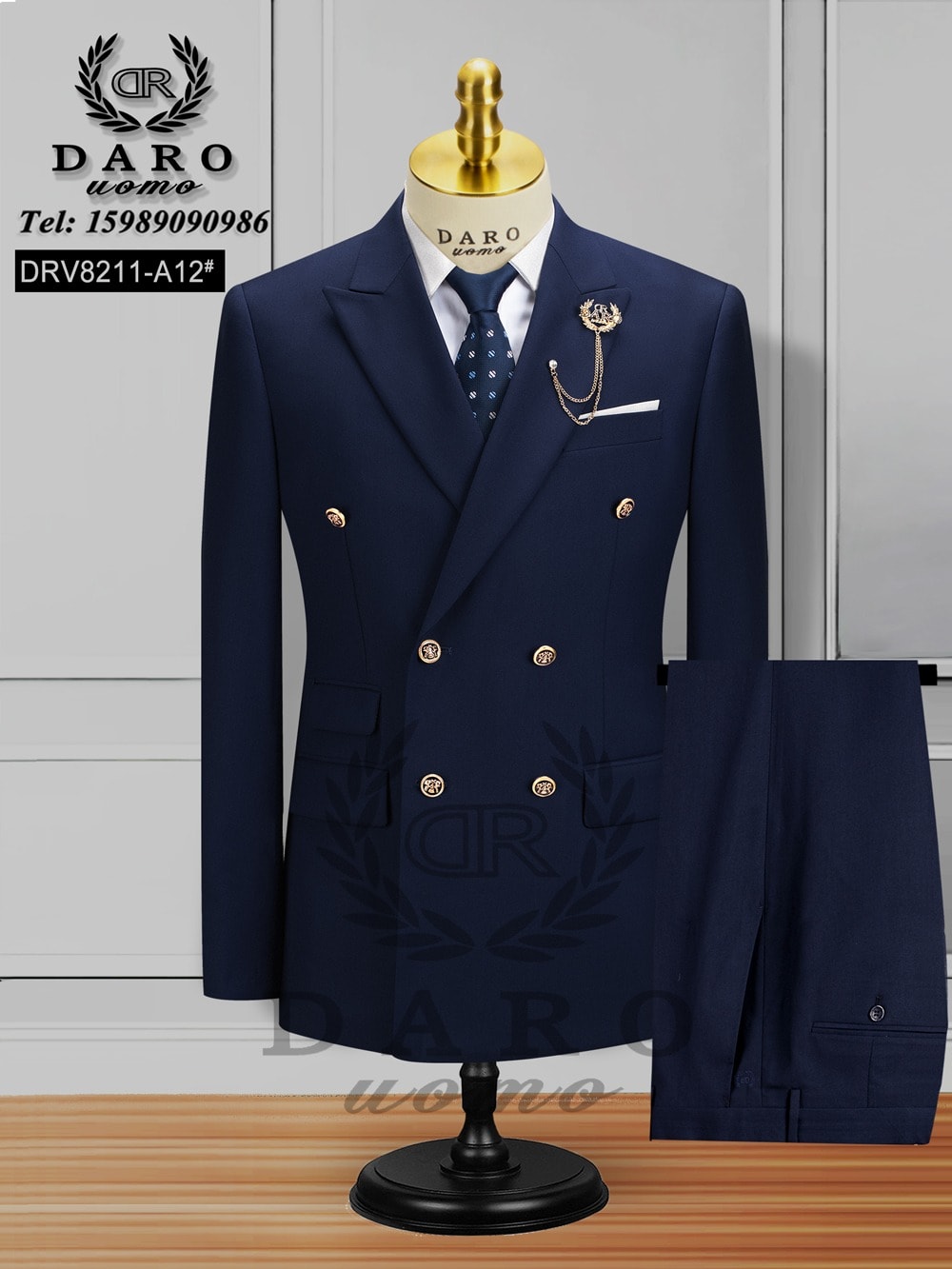 Navy blue double breasted Daro suit with white shirt, patterned tie and trousers on mannequin.