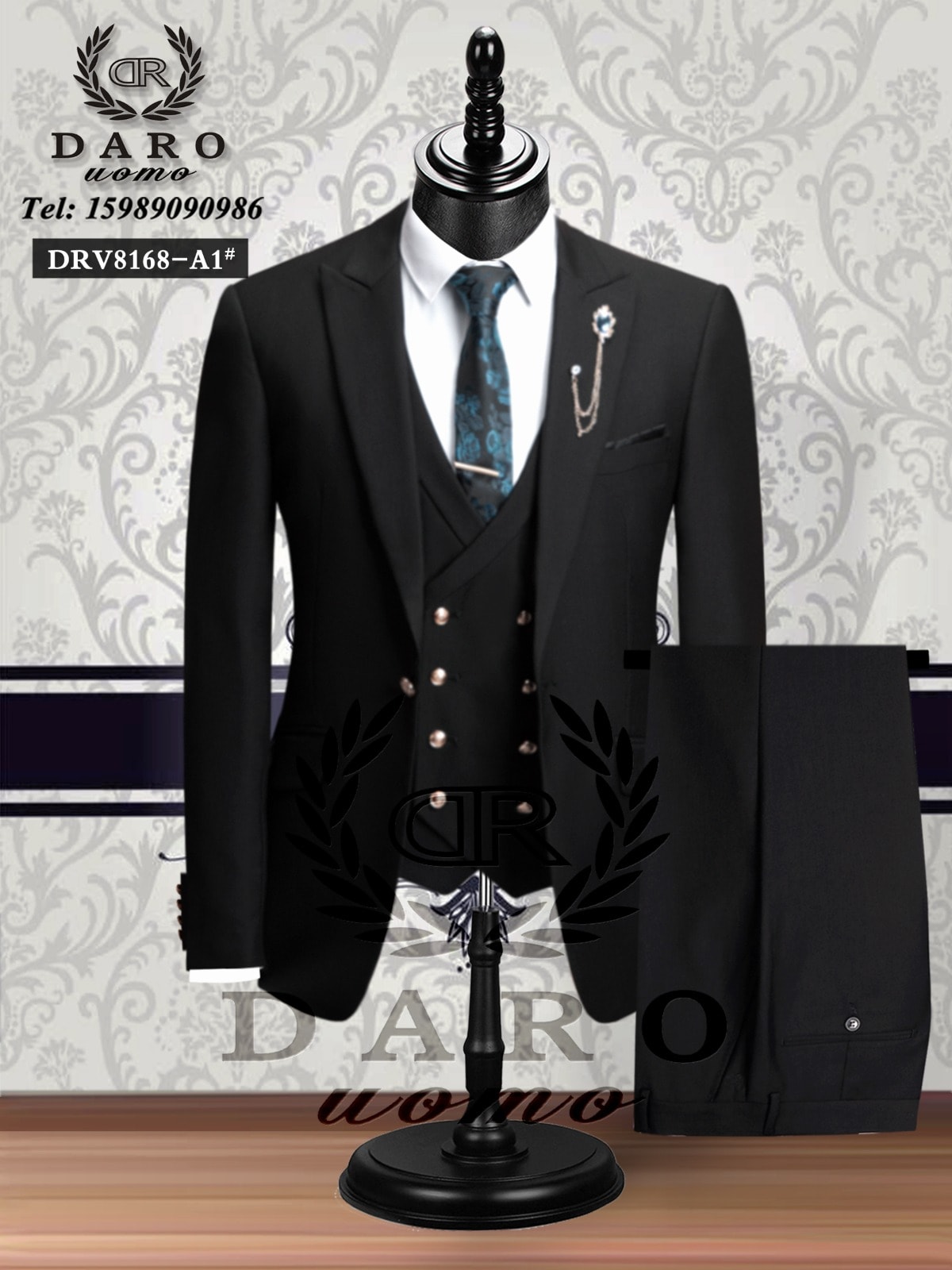 Black three-piece suit by Daro with vest, white shirt, patterned tie and trousers on mannequin.