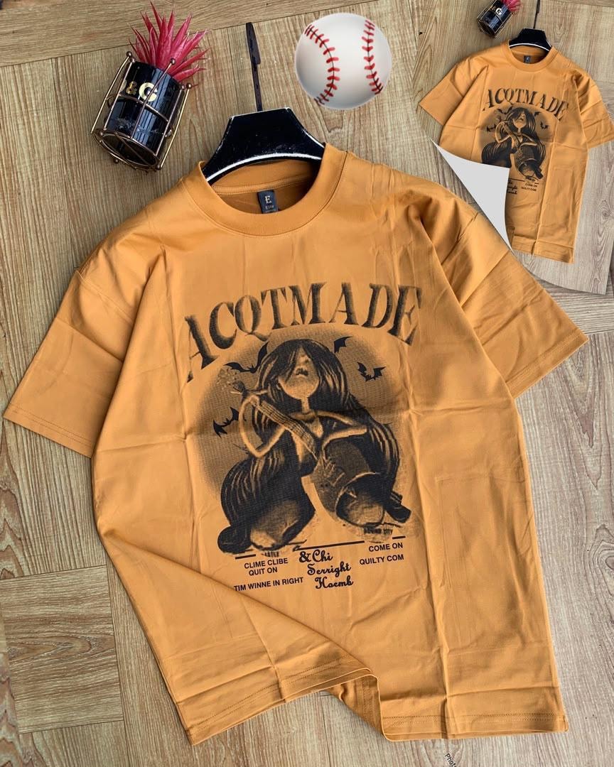 Yellow ACQTMade graphic t-shirt on hanger with inset view.