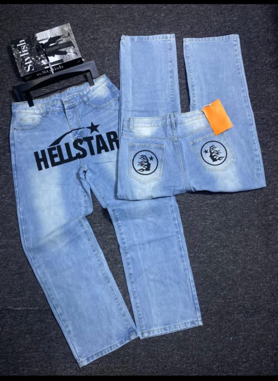 Light blue jeans with Hellstar star print on front and circular graphics on back pockets.