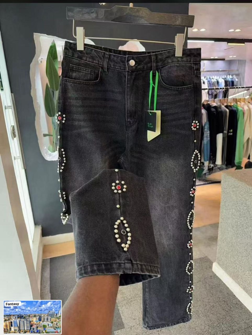 Dark wash baggy jeans with pearl and bead embellishments on sides and knee.