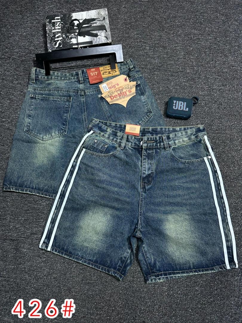 Dark blue baggy denim shorts with white side stripes shown with accessories and second style.