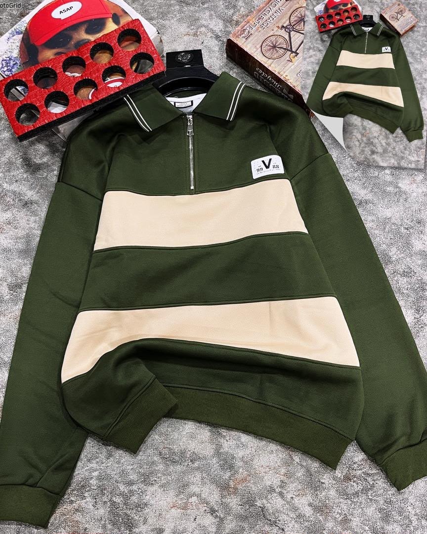 Olive striped quarter-zip long sleeve collar top laid flat with accessories.