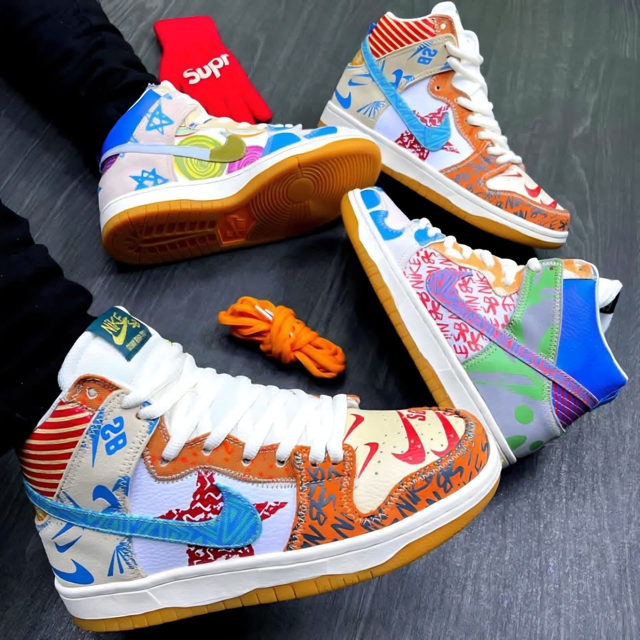Collage of multicolored patchwork Nike Dunk high-top sneakers in various vibrant patterns and graphics.